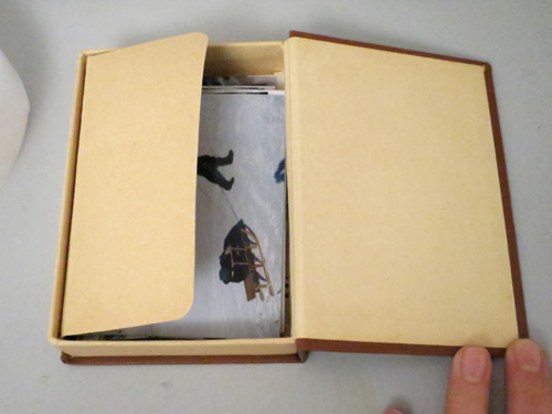 small box with real photos ....it's as close as we faithfully get to albums around here